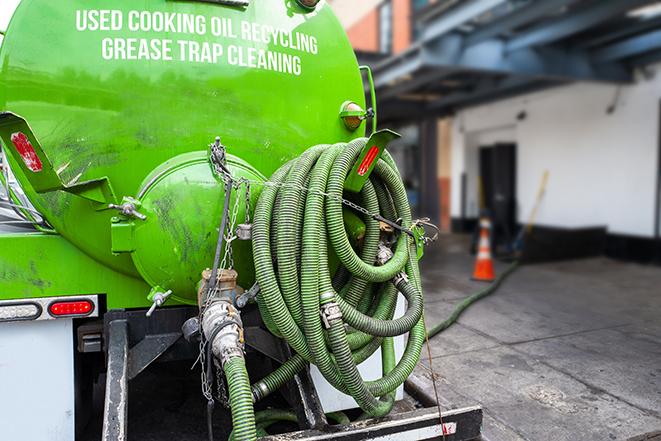 maintenance crew pumping grease trap at a fast food restaurant in Granada Hills CA